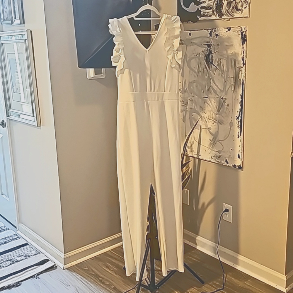 All white jumpsuit.
